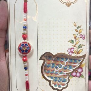 Elegant flower with rhinestones, framed by pearls and beads rakhi