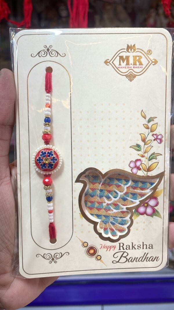 Elegant flower with rhinestones, framed by pearls and beads rakhi