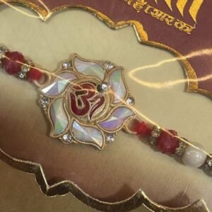 A beautifully crafted Rakhi with an Om symbol.