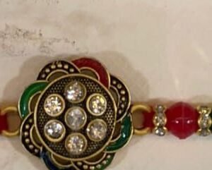 Flower central rhinestone-studded floral charm with  Indian-style rakhi bracelet