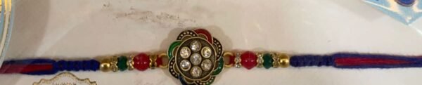 Flower central rhinestone-studded floral charm with  Indian-style rakhi bracelet