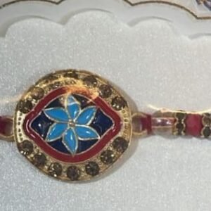 Blue flower Rakhi with maroon and gold accents bracelet