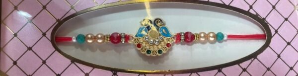 Peacock-themed rakhi with multi-colored beads and rhinestone accents bracelet